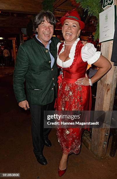 Michael Kaefer and Claudia Effenberg attend the Oktoberfest beer festival at the Kaefer tent on September 25, 2013 in Munich, Germany.