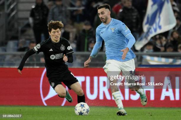 Mario Gila of SS Lazio compete for the ball with Kyogo Furuhashi of Celtic FC during the UEFA Champions League match between SS Lazio and Celtic FC...