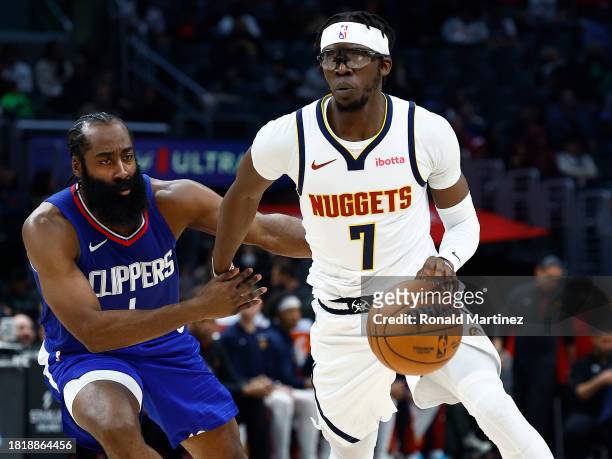 James Harden of the LA Clippers and Reggie Jackson of the Denver Nuggets at Crypto.com Arena on November 27, 2023 in Los Angeles, California. NOTE TO...