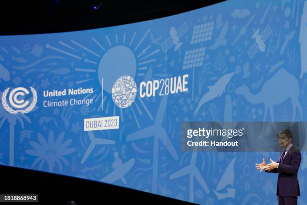 In this handout image suppled by COP28, David Miliband, President & CEO, International Rescue Committee speaks onstage at the Accelerating Climate...
