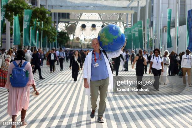 In this handout image suppled by COP28, Joseph Vipond from the Canadian Association of Physicians for the Environment at the Blue Zone during the UN...