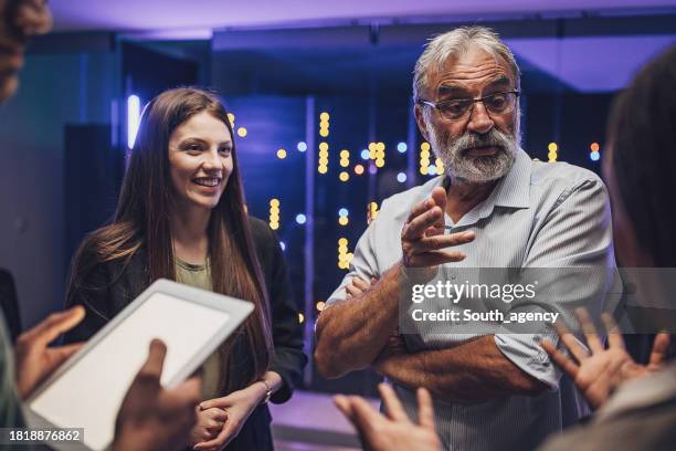 engineers together in server room - developer stock pictures, royalty-free photos & images