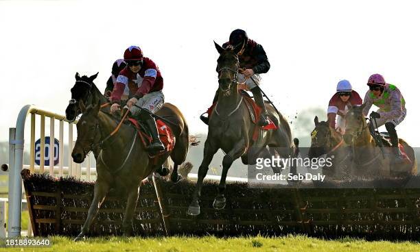 Meath , Ireland - 3 December 2023; Farren Glory, centre, with Jack Kennedy up, jumps the last on their way to winning the Bar One Racing Royal Bond...