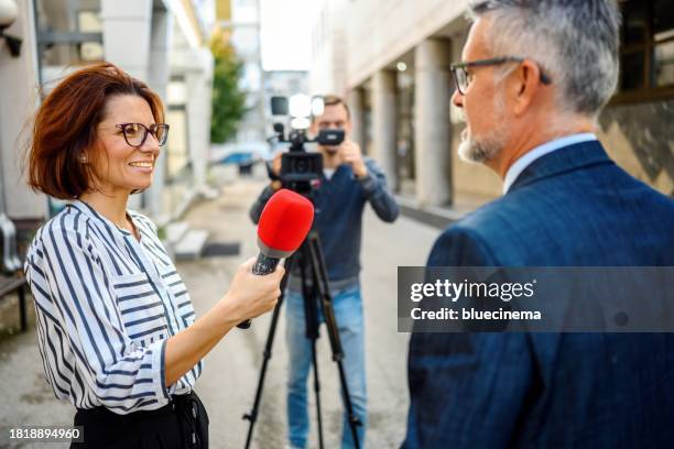 journalistic interview. - film crew interview stock pictures, royalty-free photos & images