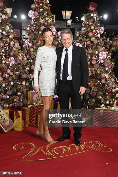 Anna Elisabet Eberstein and Hugh Grant attend the World Premiere of "Wonka" at The Royal Festival Hall on November 28, 2023 in London, England.