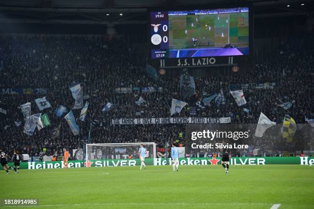 Lazio fans show a banner during the UEFA Champions League match between SS Lazio and Celtic FC at Stadio Olimpico on November 28, 2023 in Rome, Italy.