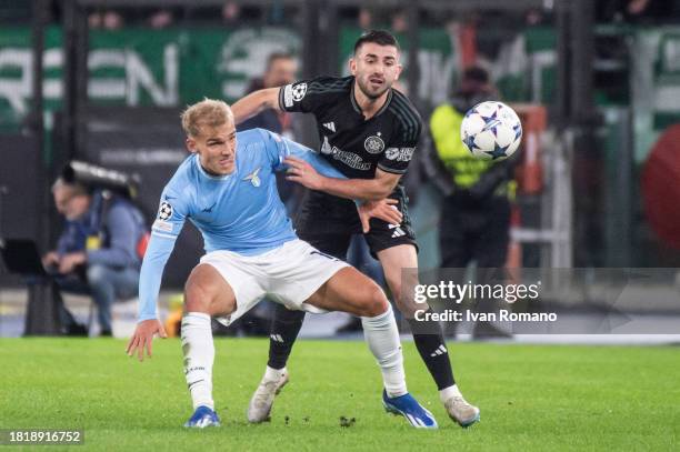 Gustav Isaksen of SS Lazio and Greg Taylor of Celtic FC compete for the ball during the UEFA Champions League match between SS Lazio and Celtic FC at...