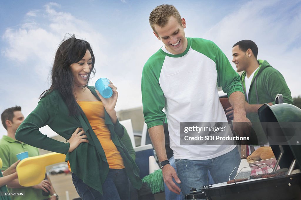 Group of college friends tailgating before football game
