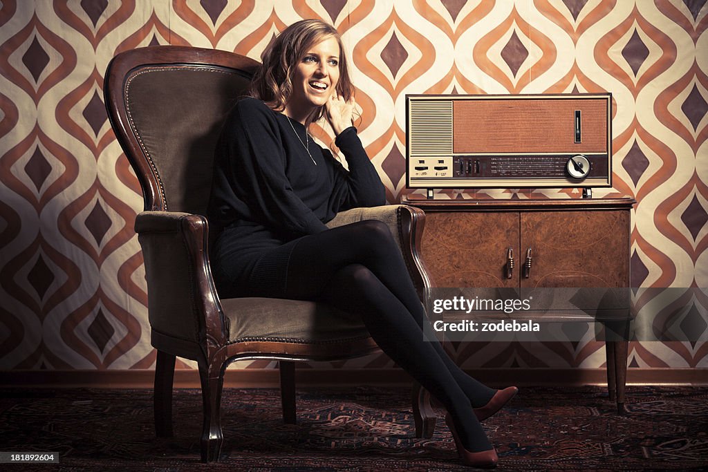 Beautiful Retro Woman Listening News on Vintage Radio