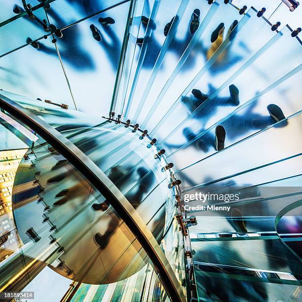 architecture,footprints on modern glass staircase - low angle view of silhouette palm trees against sky stockfoto's en -beelden