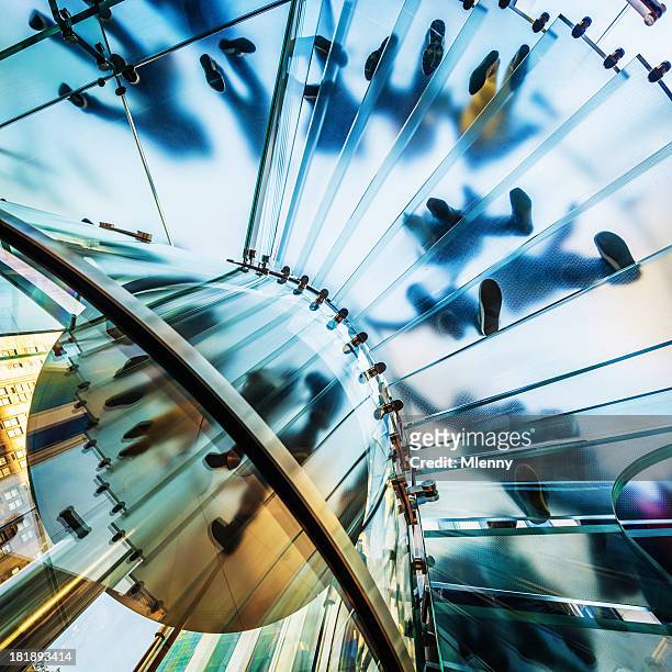 architecture,footprints on modern glass staircase - spiral staircase stock pictures, royalty-free photos & images