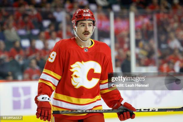 Dillon Dube of the Calgary Flames during a break in play against the Vegas Golden Knights at the Scotiabank Saddledome on November 27, 2023 in...