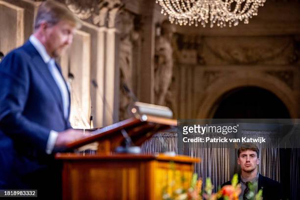 King Willem-Alexander of The Netherlands reads the laudation for Erasmus Prize winner Trevor Noah at the Royal Palace Amsterdam on November 28, 2023...