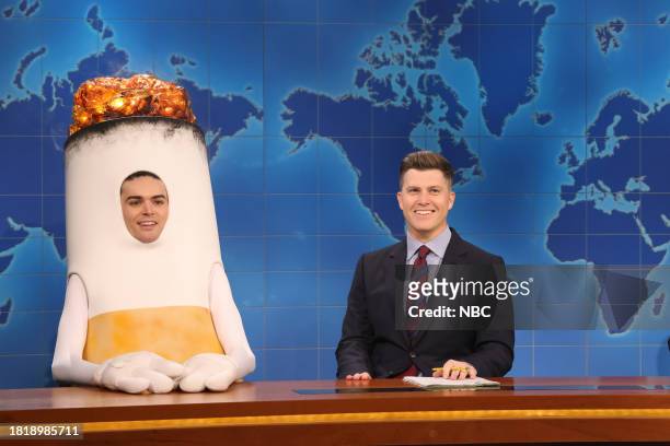 Emma Stone, Noah Kahan" Episode 1850 -- Pictured: Michael Longfellow as Old Fashioned Cigarette and anchor Colin Jost during Weekend Update on...
