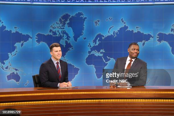 Emma Stone, Noah Kahan" Episode 1850 -- Pictured: Anchor Colin Jost and anchor Michael Che during Weekend Update on Saturday, December 2, 2023 --