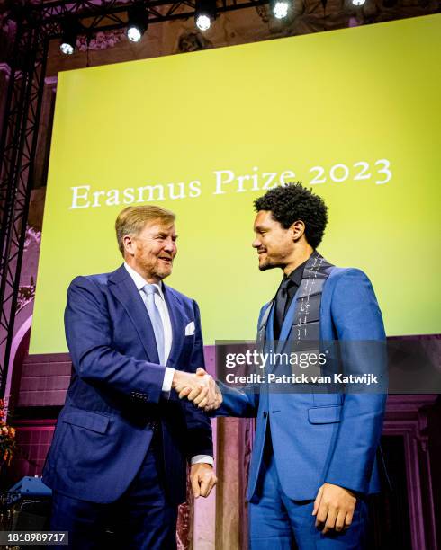 Comedian Trevor Noah receives the Erasmus Prize from King Willem-Alexander of The Netherlands at the Royal Palace Amsterdam on November 28, 2023 in...