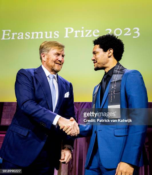 Comedian Trevor Noah receives the Erasmus Prize from King Willem-Alexander of The Netherlands at the Royal Palace Amsterdam on November 28, 2023 in...