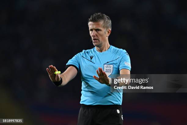 Referee Daniele Orsato gestures during the UEFA Champions League match between FC Barcelona and FC Porto at Estadi Olimpic Lluis Companys on November...