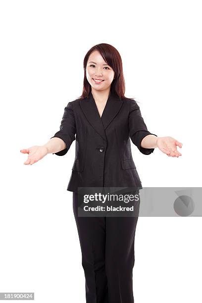 chinese businesswoman arms outreached smiling on white background - beckoning stock pictures, royalty-free photos & images