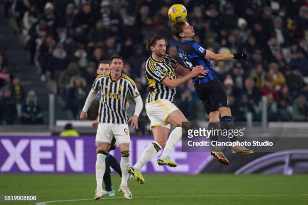Nicolo Barella of FC Internazionale competes for the ball with Adrien Rabiot of Juventus during the Serie A TIM match between Juventus and FC...