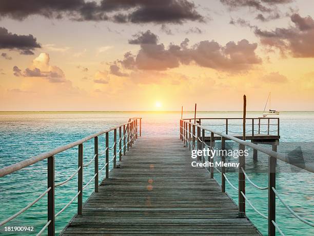 huahine sunset scene at jetty, french polynesia - jetty stock pictures, royalty-free photos & images