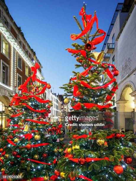 christmas celebration in london west end - tradition town square stock pictures, royalty-free photos & images