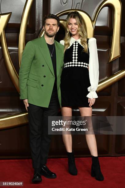Joel Dommett and Hannah Cooper attend the "Wonka" World Premiere at The Royal Festival Hall on November 28, 2023 in London, England.