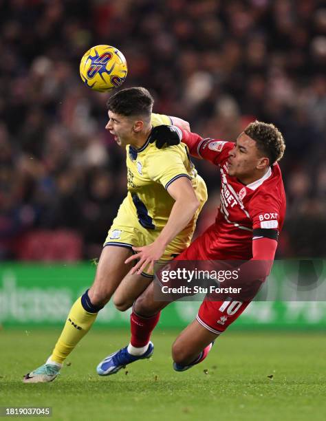 Preston defender Jordan Storey is challenged by Morgan Rogers of Middlesbrough during the Sky Bet Championship match between Middlesbrough and...