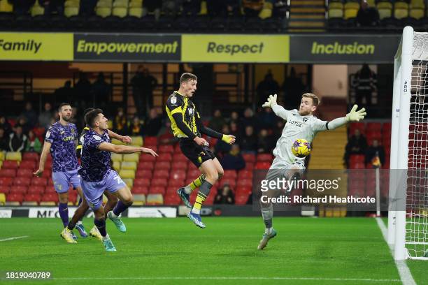 Mileta Rajovic of Watford scores the team's second goal past George Long of Norwich City during the Sky Bet Championship match between Watford and...