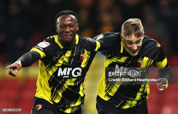 Mileta Rajovic of Watford celebrates with teammate Ismael Kone after scoring the team's second goal during the Sky Bet Championship match between...