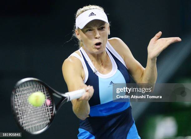 Caroline Wozniacki of Denmark in action during her women's singles quarter final match against Lucie Safarova of Czech Republic during day five of...