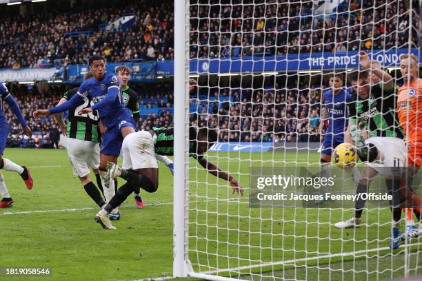 Levi Colwill of Chelsea scores the second goal for his team despite the effort of Billy Gilmour of Brighton & Hove Albion to clear the ball during...