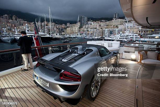 Porsche 918 Spyder automobile, produced by Porsche SE, sits on the deck of the 88m luxury superyacht Quattroelle, built by Lurssen Werft GmbH & Co....