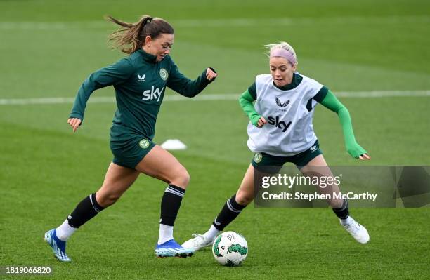 Dublin , Ireland - 3 December 2023; Katie McCabe in action against Denise O'Sullivan, right, during a Republic of Ireland women training session at...