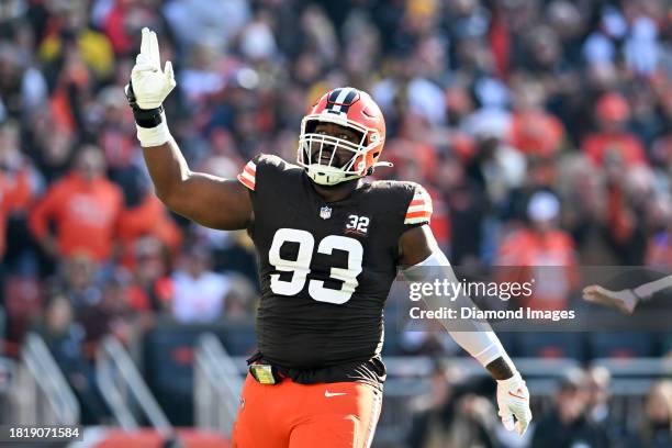 Shelby Harris of the Cleveland Browns celebrates blocking a pass during the first half against the Pittsburgh Steelers at Cleveland Browns Stadium on...