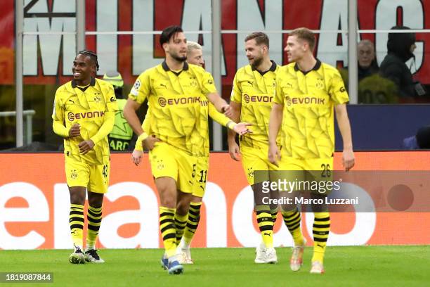 Jamie Bynoe-Gittens of Borussia Dortmund celebrates with team mates after scoring the team's second goal during the UEFA Champions League match...