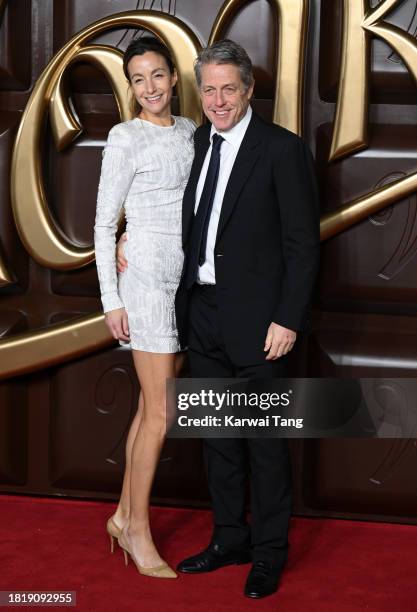 Anna Elisabet Eberstein and Hugh Grant arrive at the "Wonka" World Premiere at The Royal Festival Hall on November 28, 2023 in London, England.