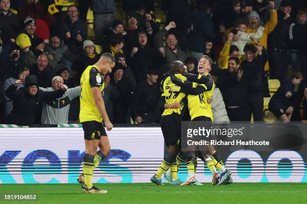 Yaser Asprilla of Watford celebrates with teammates after scoring the team's third goal during the Sky Bet Championship match between Watford and...