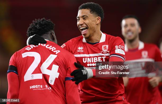 Middlesbrough player Alex Bangura celebrates with team mate Sammy Silvera after scoring the fourth goal during the Sky Bet Championship match between...