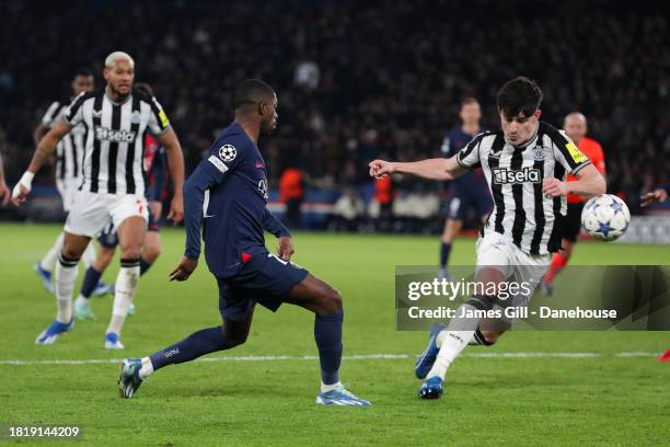 The ball strikes the arm of Tino Livramento of Newcastle United resulting in a penalty kick to Paris Saint-Germain during the UEFA Champions League...