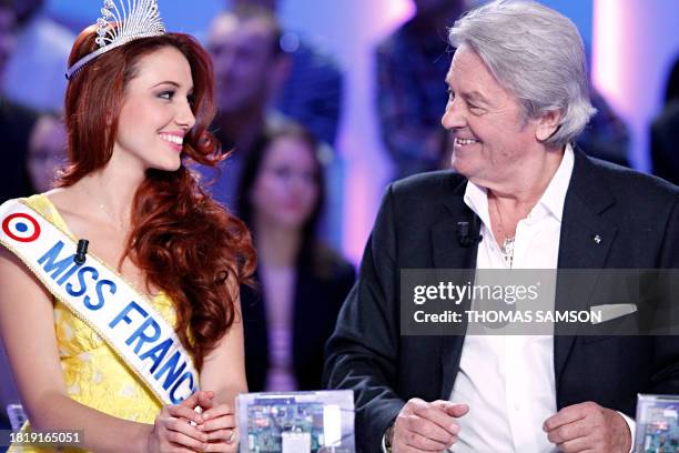 Newly crowned Miss France 2012 Delphine Wespiser and French actor and honorary president of the Miss France beauty contest Alain Delon take part in...