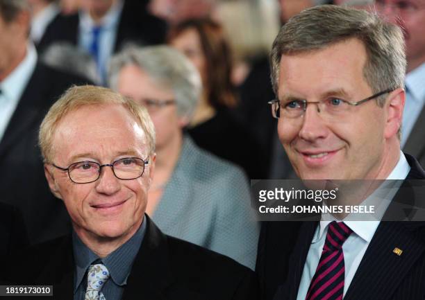 Israli author and prize winner David Grossman and German President Christian Wulff pose before the awarding ceremony for the Peace Prize of the...