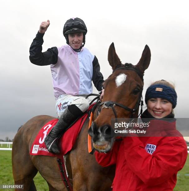 Meath , Ireland - 3 December 2023; Jockey Jack Kennedy celebrates with groom Erika Peciulyte after riding Teahupoo to victory in the Bar One Racing...