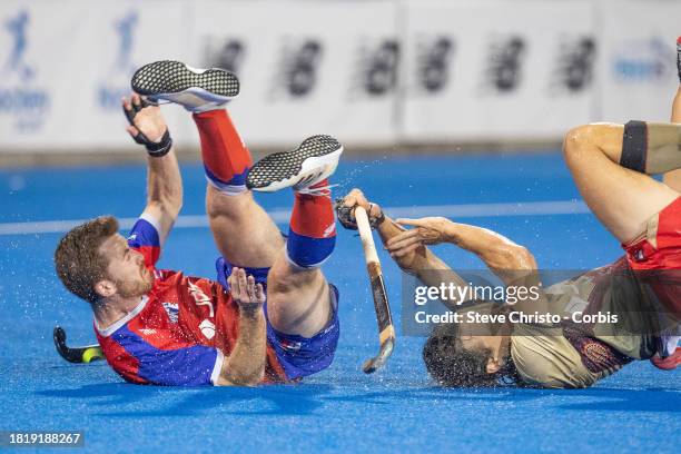 Tom Craig of the Pride collides with Fire's Matthew Magann while scoring a goal during the Hockey One round seven match between New South Wales Pride...