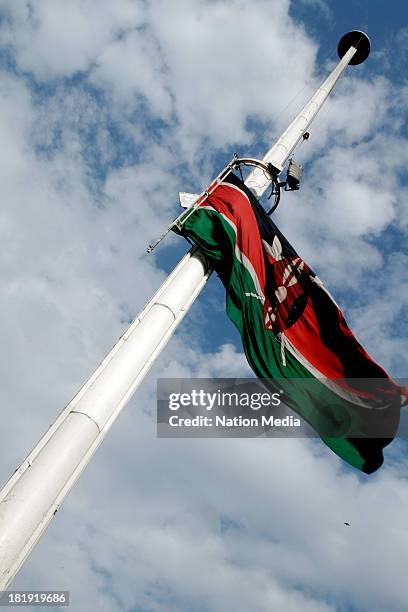 The Kenyan Flag flies at half mast to honour the victims of the Westgate Mall attack on September 25, 2013 in Nairobi, Kenya. The Mall was hit with a...