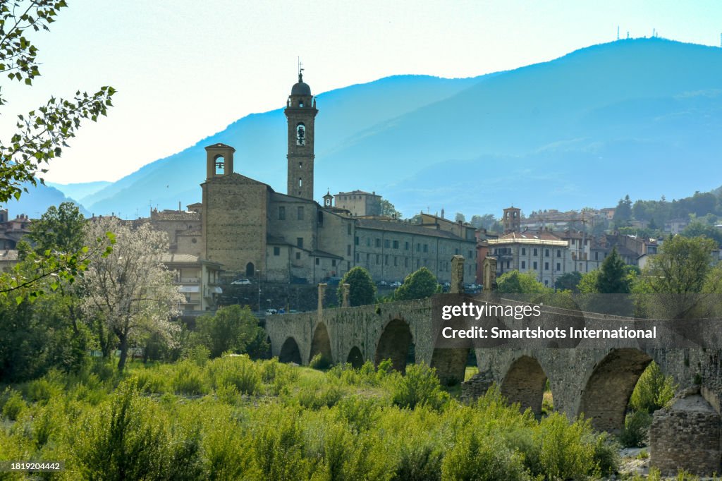 Medieval cityscape of Bobbio in "Trebbia valley" with Roman bridge ("Ponte Vecchio"), Trebbia river and medieval old town of Bobbio in the background in Emilia-Romagna, Italy