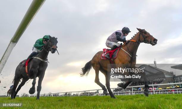Meath , Ireland - 3 December 2023; Teahupoo, right, with Jack Kennedy up, on their way to winning the Bar One Racing Hatton's Grace Hurdle, from...