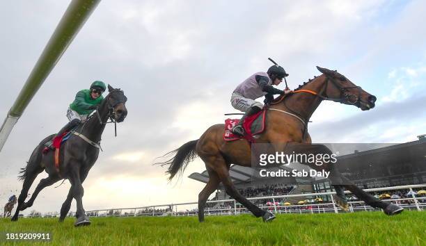 Meath , Ireland - 3 December 2023; Teahupoo, right, with Jack Kennedy up, on their way to winning the Bar One Racing Hatton's Grace Hurdle, from...