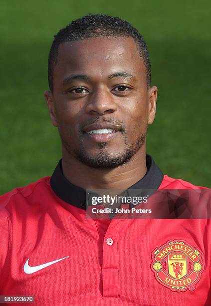 Patrice Evra of Manchester United poses at the annual club photocall at Old Trafford on September 26, 2013 in Manchester, England.