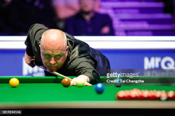 John Higgins of Scotland plays a shot in the first round match against Joe O'Connor of England on day 4 of the 2023 MrQ UK Championship at Barbican...